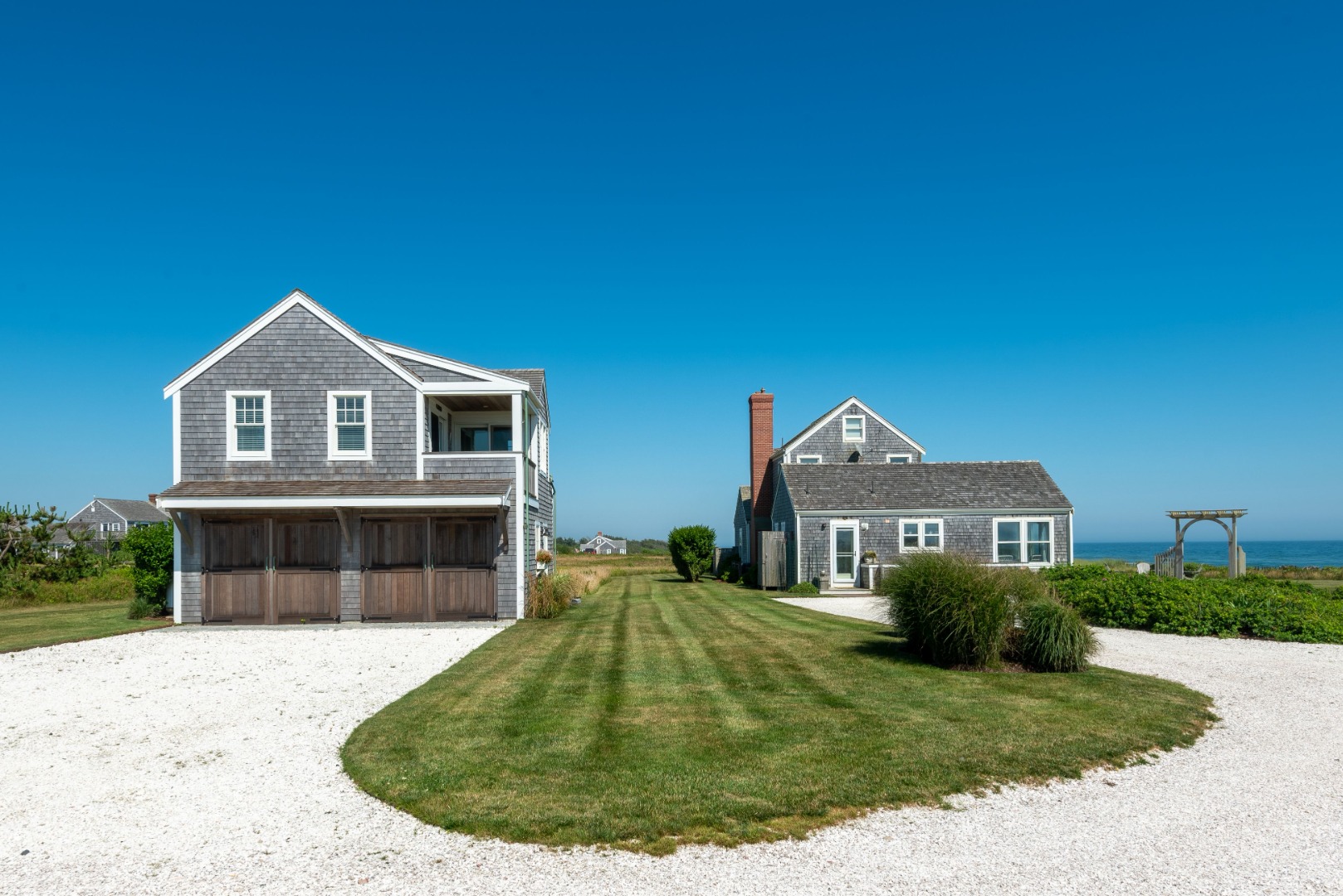 56 R Madequecham Valley Road Nantucket, MA 02554 - Photo 6 of 52 a front view of a house with a yard