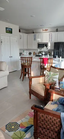 a kitchen with a refrigerator and a stove top oven
