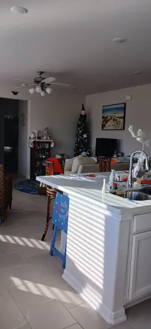 a utility room with sink dryer and washer