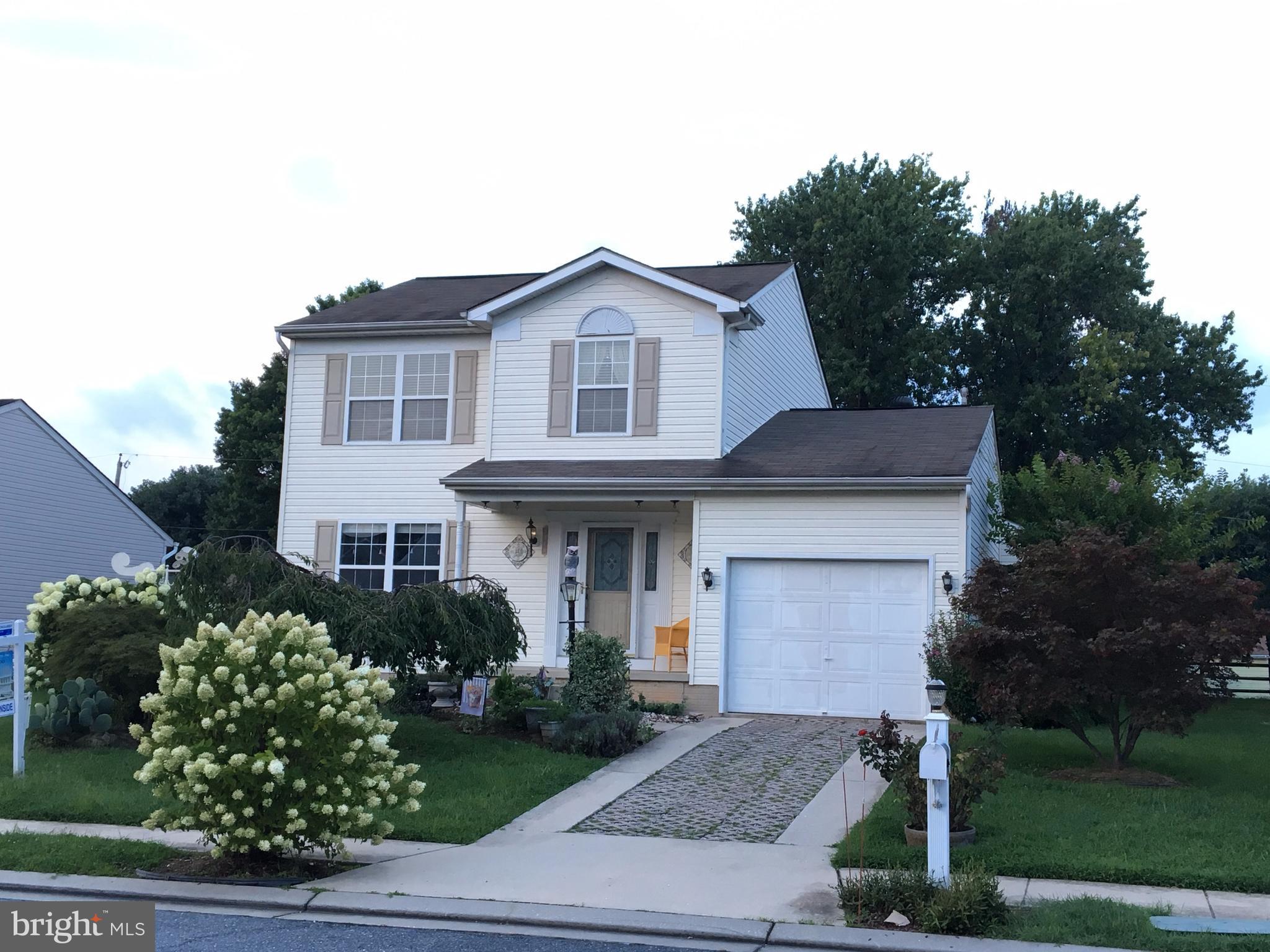 9316 Sea Point Road Baltimore, MD 21219 - Photo 1 of 30 a front view of a house with garden
