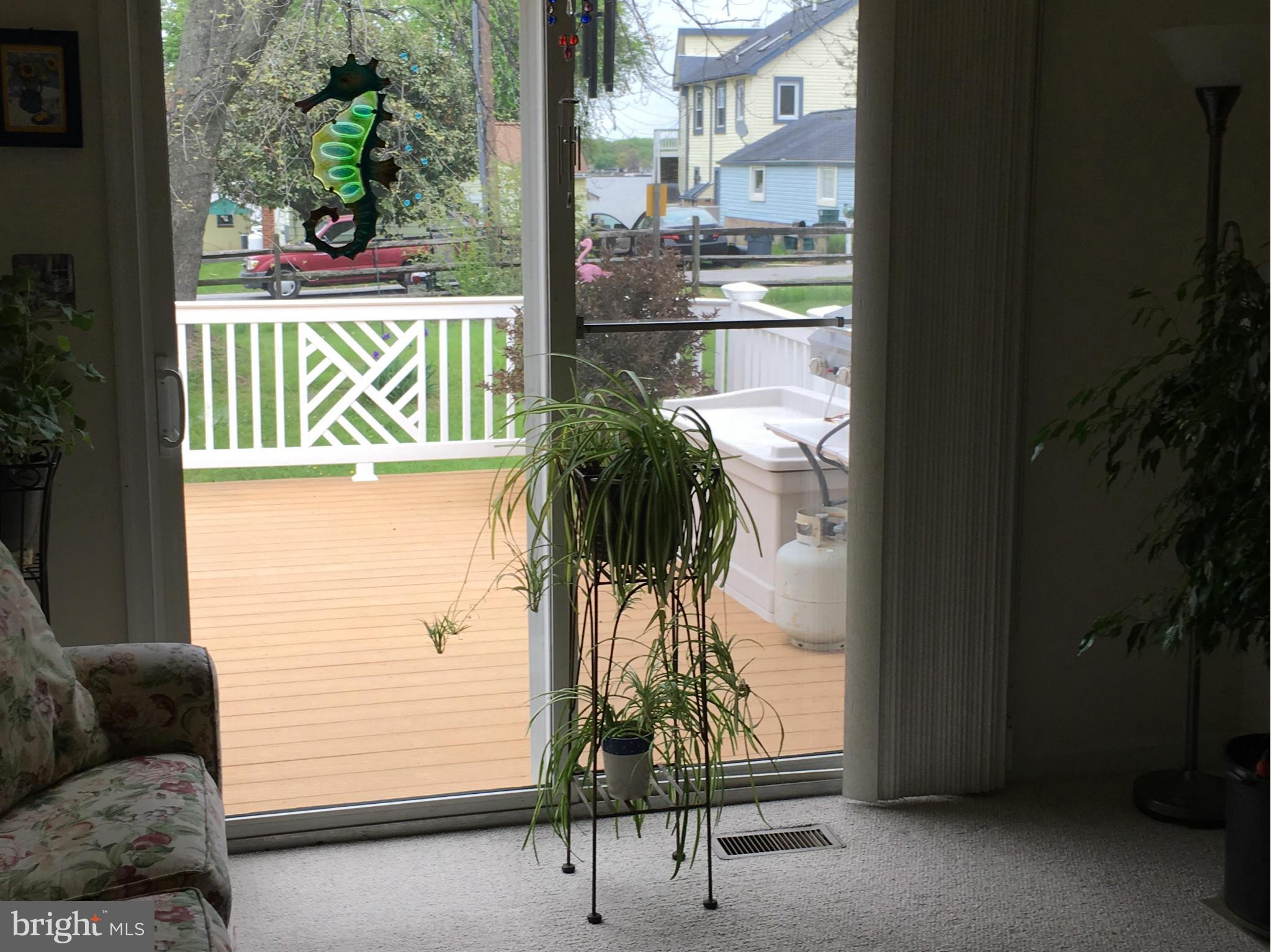 9316 Sea Point Road Baltimore, MD 21219 - Photo 5 of 30 a view of a glass door and chair