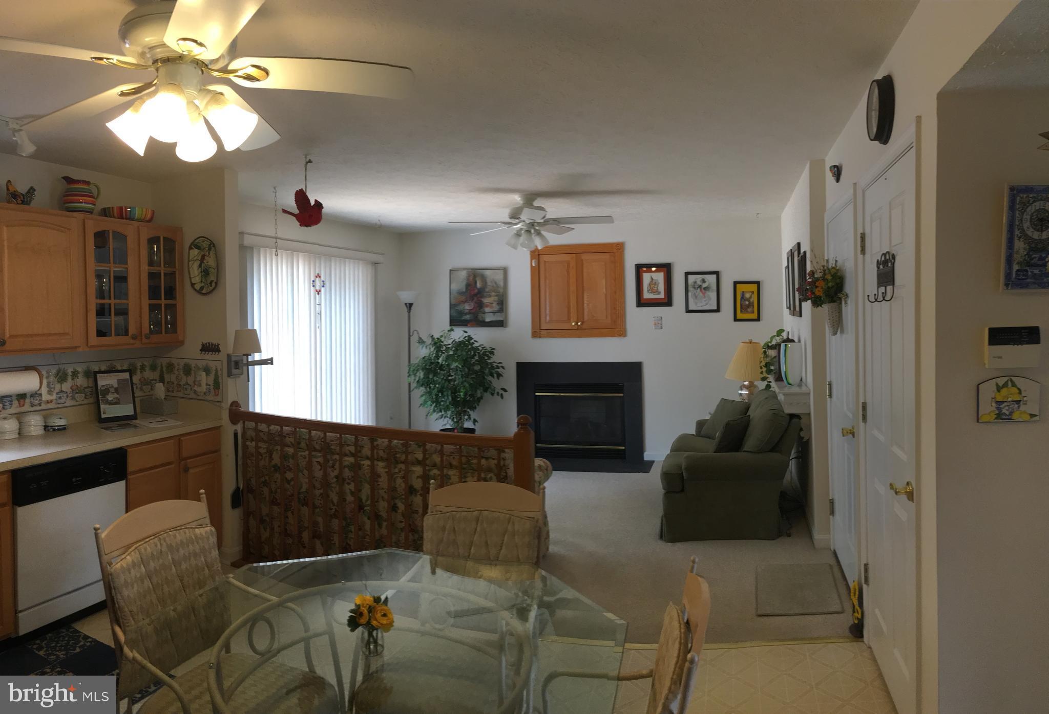 9316 Sea Point Road Baltimore, MD 21219 - Photo 6 of 30 a living room with furniture and a fireplace