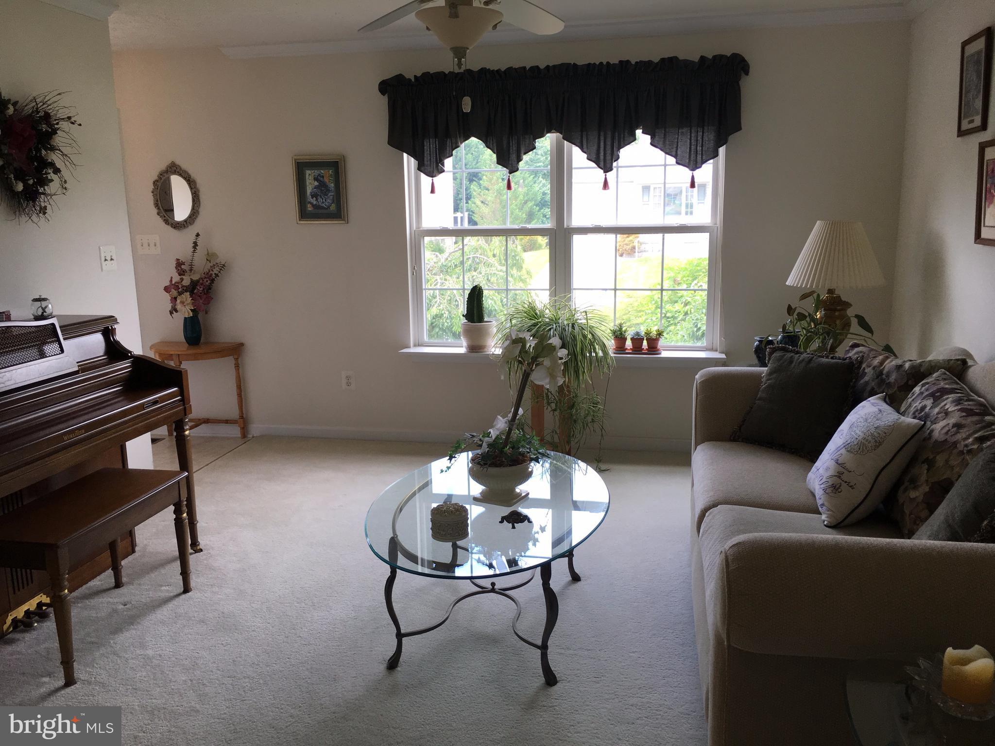 9316 Sea Point Road Baltimore, MD 21219 - Photo 9 of 30 a living room with furniture and a large window
