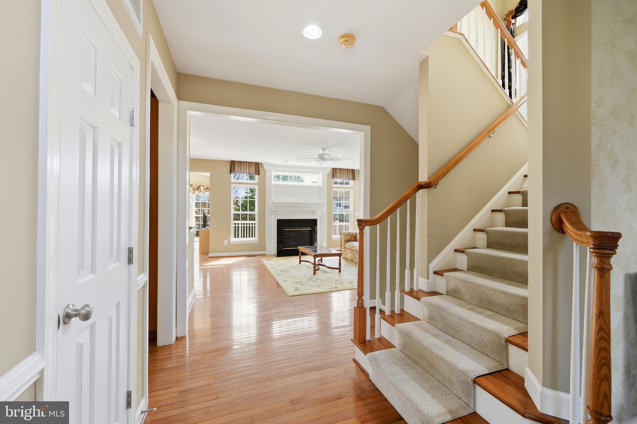 103 Sutton Way Chestertown, MD 21620 - Photo 14 of 53 a view of staircase with fireplace and wooden floor