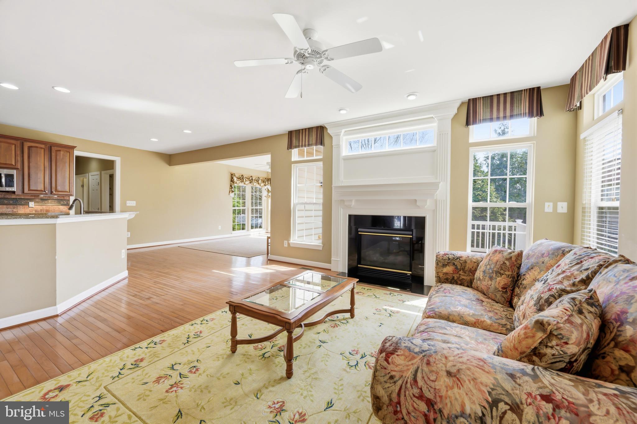 103 Sutton Way Chestertown, MD 21620 - Photo 16 of 53 a living room with furniture a fireplace and a flat screen tv