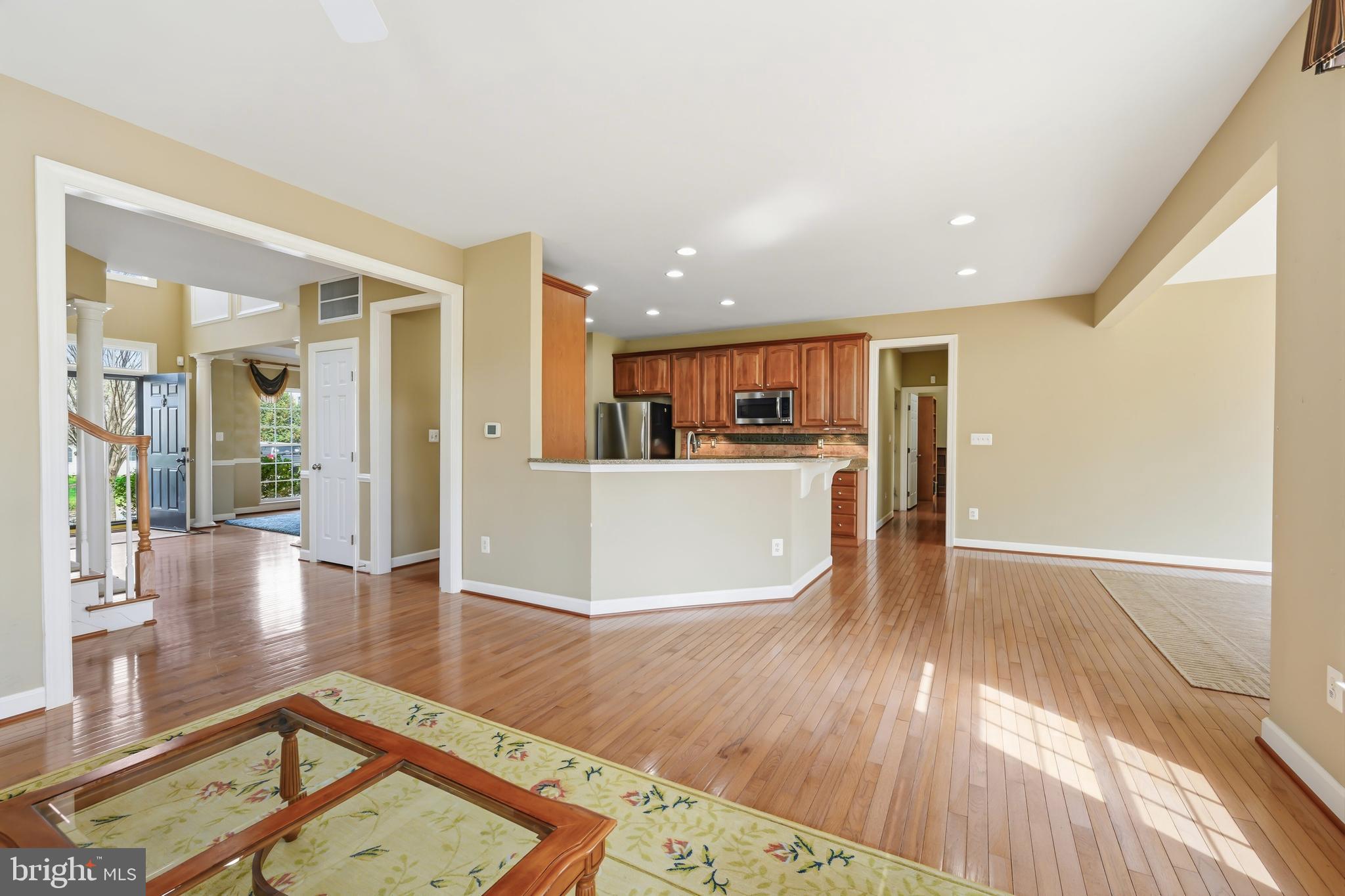 103 Sutton Way Chestertown, MD 21620 - Photo 17 of 53 a view of a living room and kitchen with furniture wooden floor