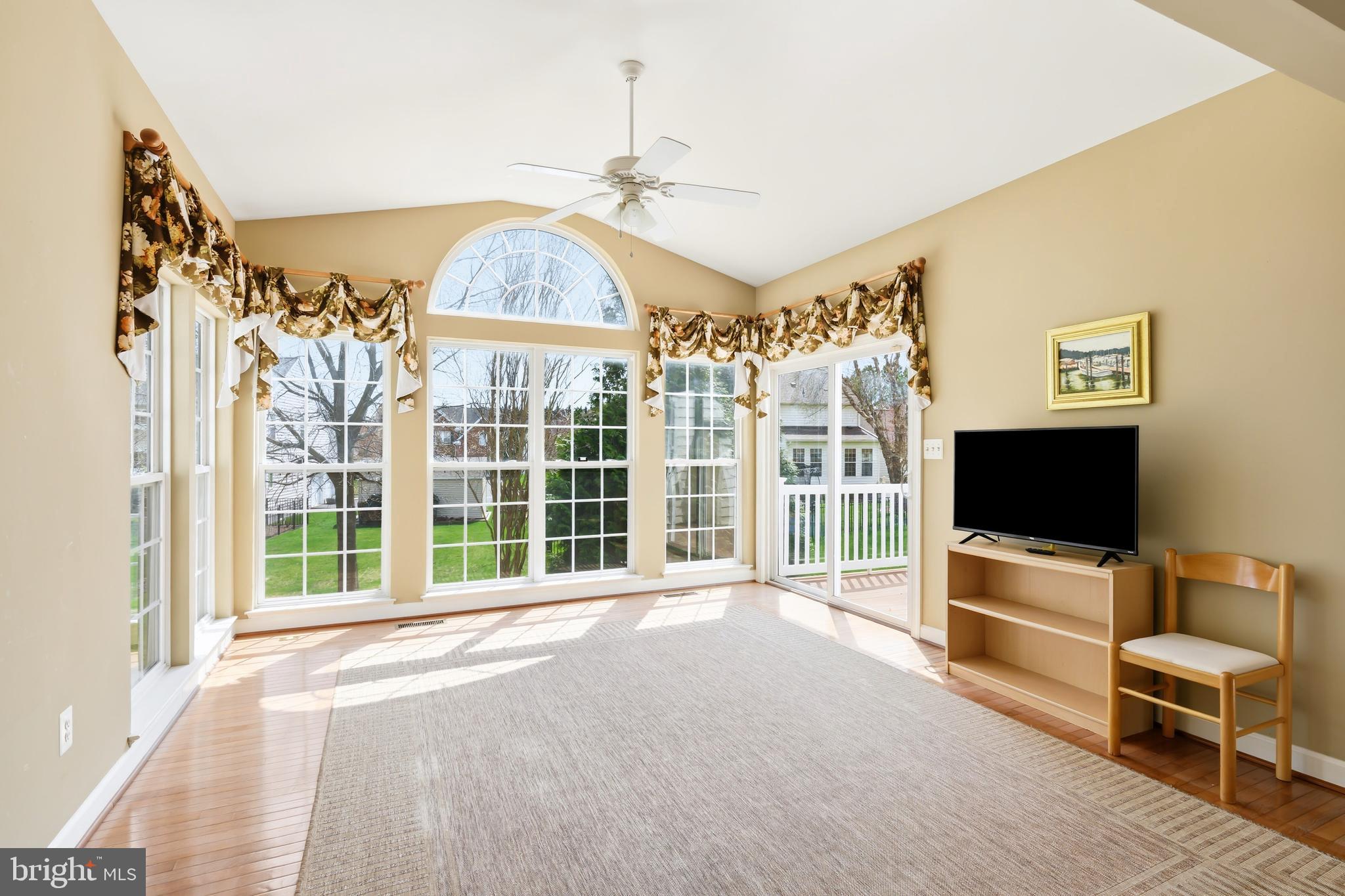 103 Sutton Way Chestertown, MD 21620 - Photo 19 of 53 a living room with furniture a flat screen tv and a large window