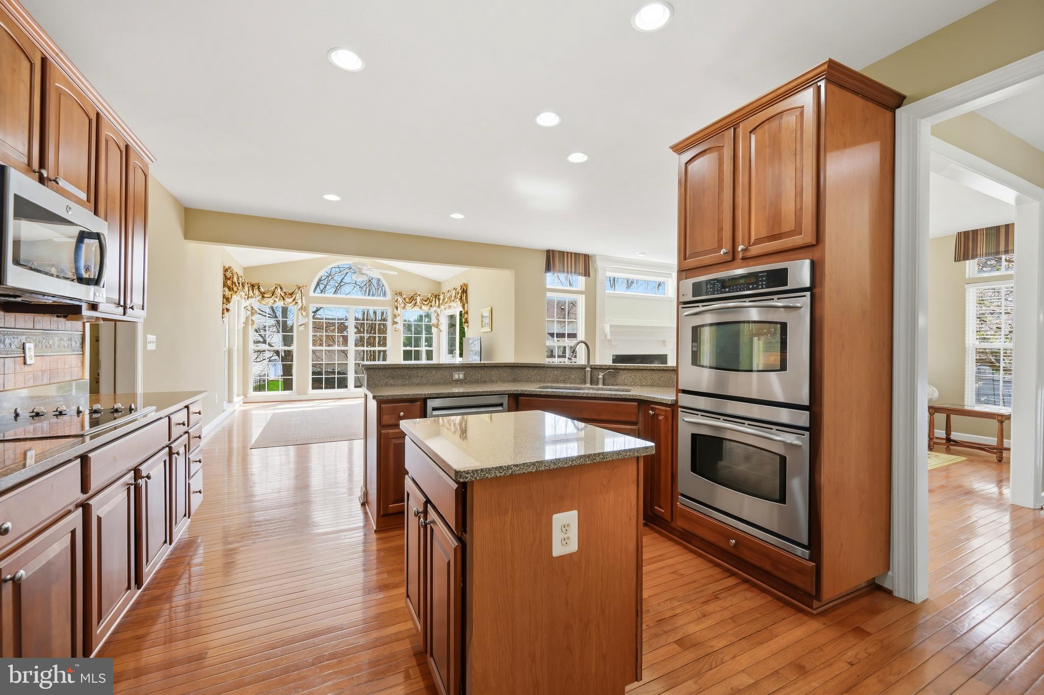 103 Sutton Way Chestertown, MD 21620 - Photo 25 of 53 a kitchen with stainless steel appliances granite countertop a stove a sink and a refrigerator