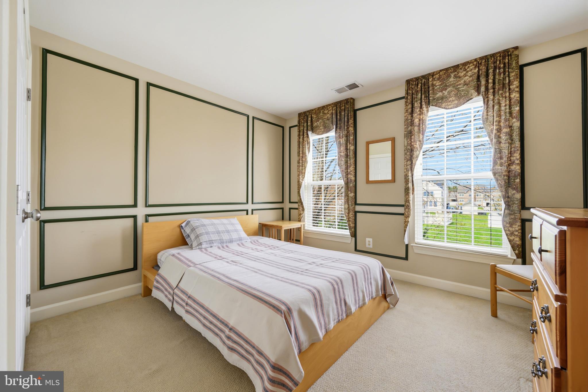 103 Sutton Way Chestertown, MD 21620 - Photo 38 of 53 a bedroom with a bed and a dresser next to a window