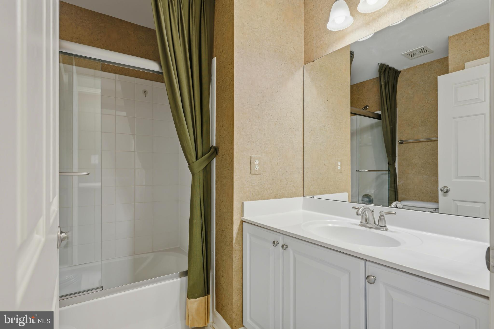 103 Sutton Way Chestertown, MD 21620 - Photo 44 of 53 a bathroom with a sink a mirror and a shower