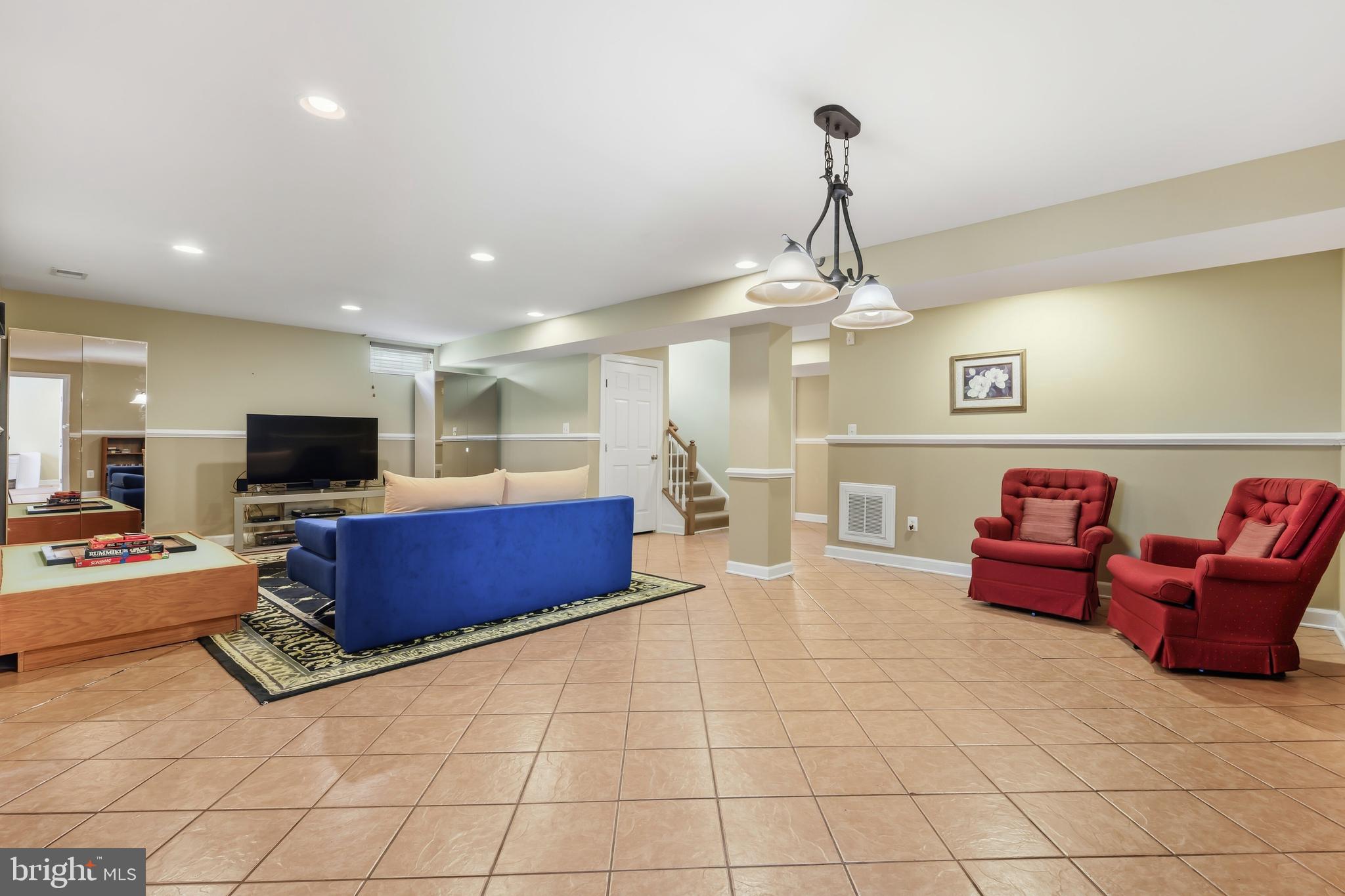 103 Sutton Way Chestertown, MD 21620 - Photo 46 of 53 a living room with furniture and a flat screen tv