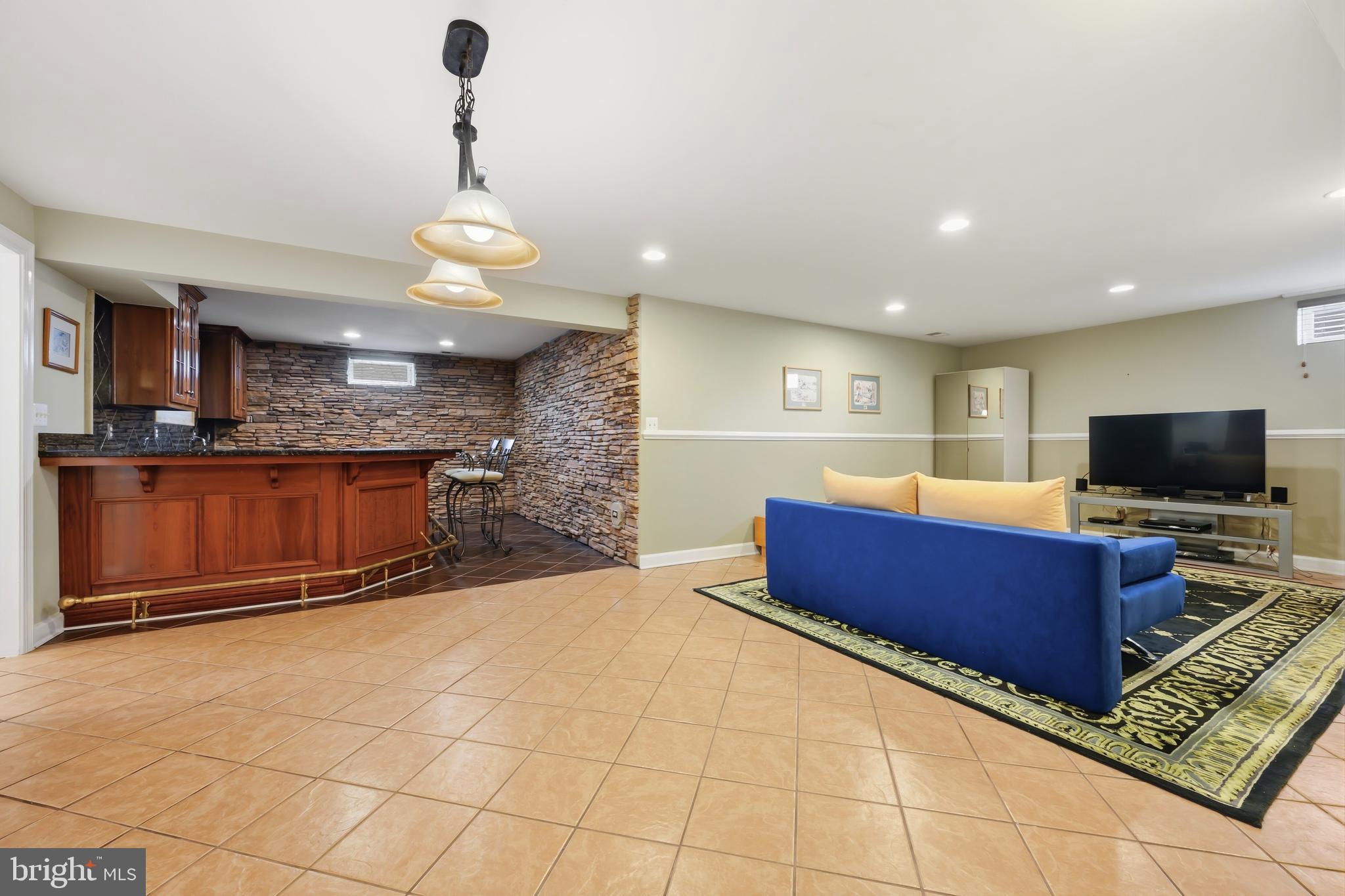 103 Sutton Way Chestertown, MD 21620 - Photo 47 of 53 a living room with furniture and a flat screen tv