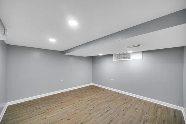 a view of a room with gym equipment and a window