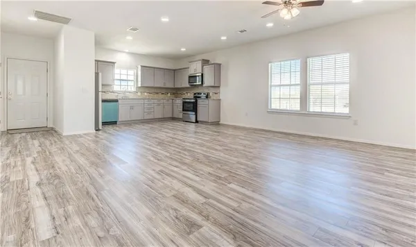 a view of kitchen with wooden floor and window