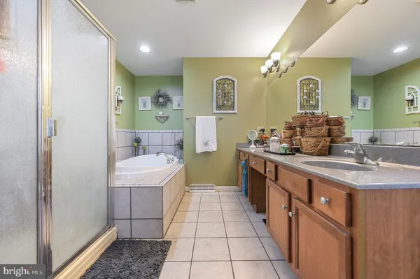 a bathroom with a sink a toilet a mirror and vanity