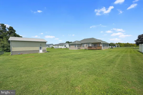 a view of a house with a yard and garage