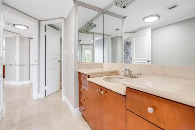 a living room with furniture gym equipment and a large window