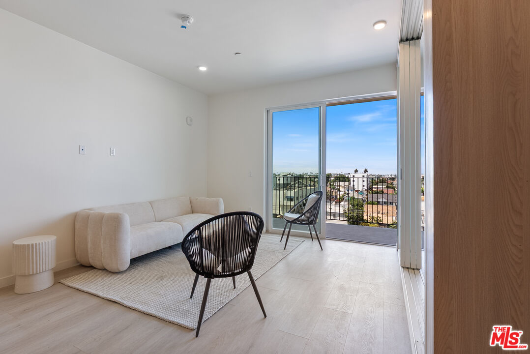 a view of a livingroom with furniture and a window