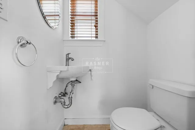 a bathroom with a toilet and a sink