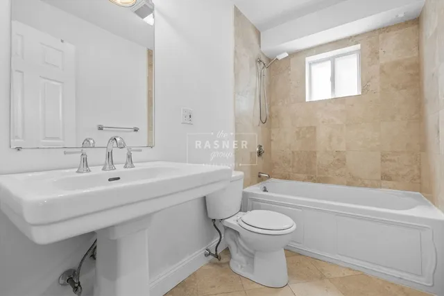 a bathroom with a sink a toilet and a bathtub