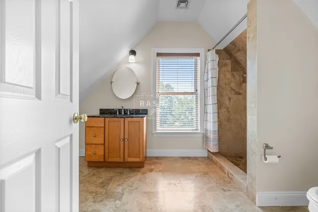 a view of a room with wooden floor and window
