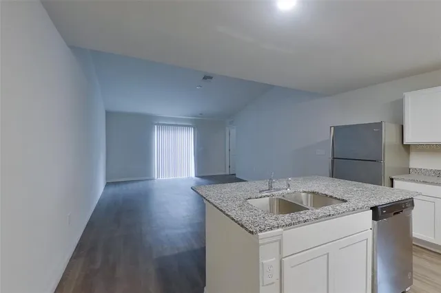 a kitchen with a sink and cabinets