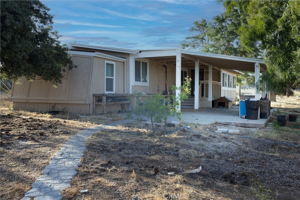 59760 Grandon Road Anza, CA 92539 - Photo 1 of 1 a front view of a house with garden