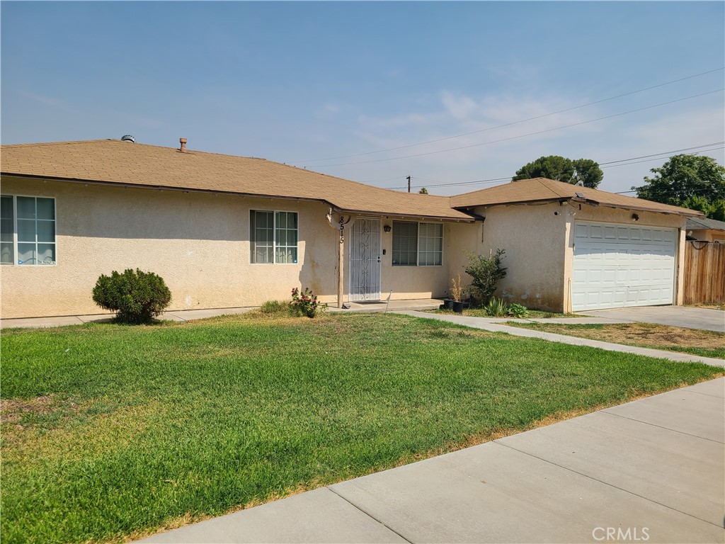 8515 Gramercy Place Riverside, CA 92503 - Photo 1 of 1 a front view of a house with a garden and plants