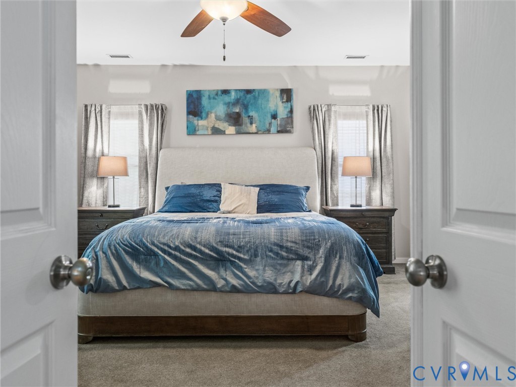 10824 Avening Road Chesterfield, VA 23832 - Photo 21 of 47 a bedroom with a bed and window