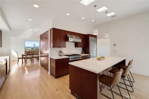 a kitchen with a table and chairs in it