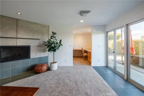 a bedroom with furniture and a potted plant