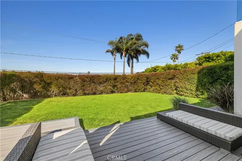 a view of a backyard with wooden floor