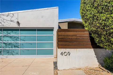 a view of outdoor space with building and entryway