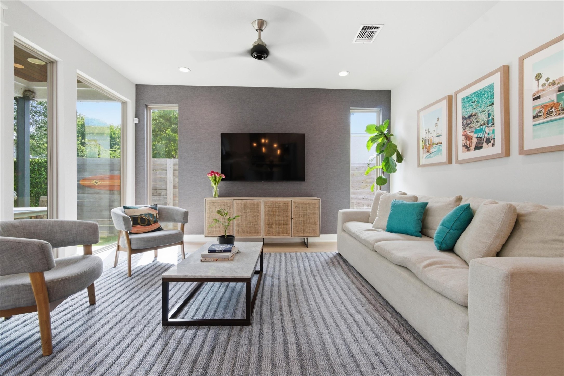 2710 Zaragosa Street, Unit A Austin, TX 78702 - Photo 12 of 29 Sun-drenched living room with a ceiling fan and easy access to the open kitchen.