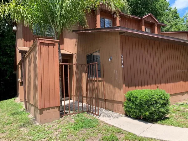 a view of a back yard of the house