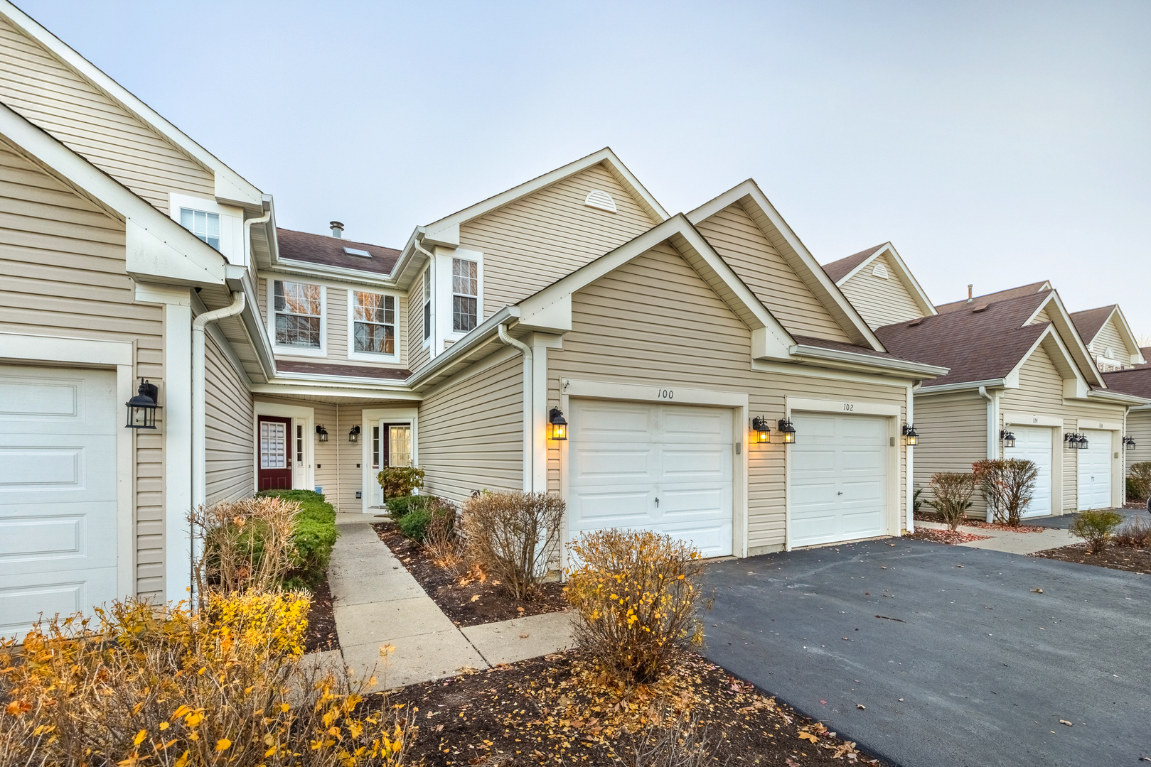 a front view of a house with a yard