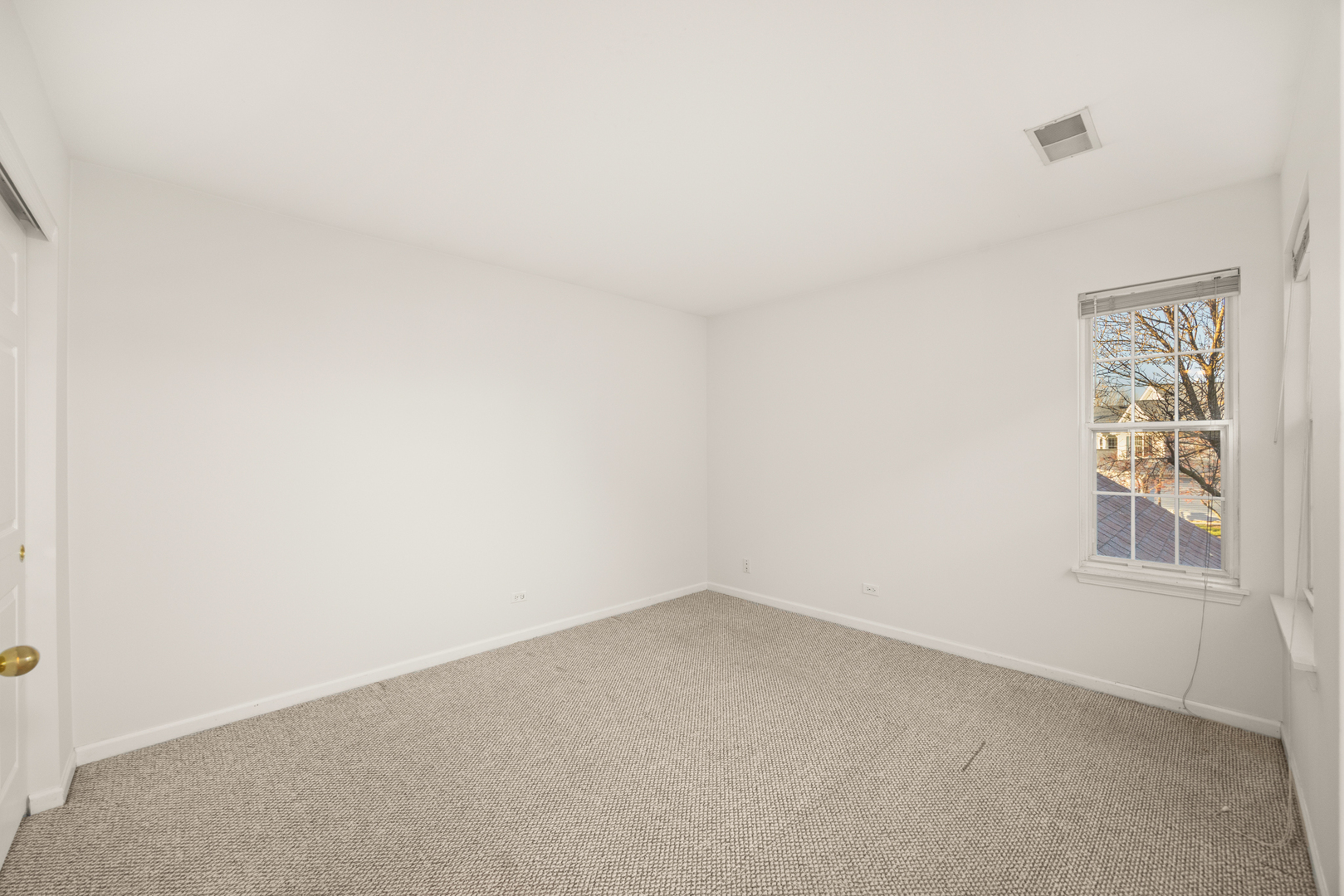 100 Harvest Gate, Unit 100 Lake In The Hills, IL 60156 - Photo 11 of 17 an empty room with a window