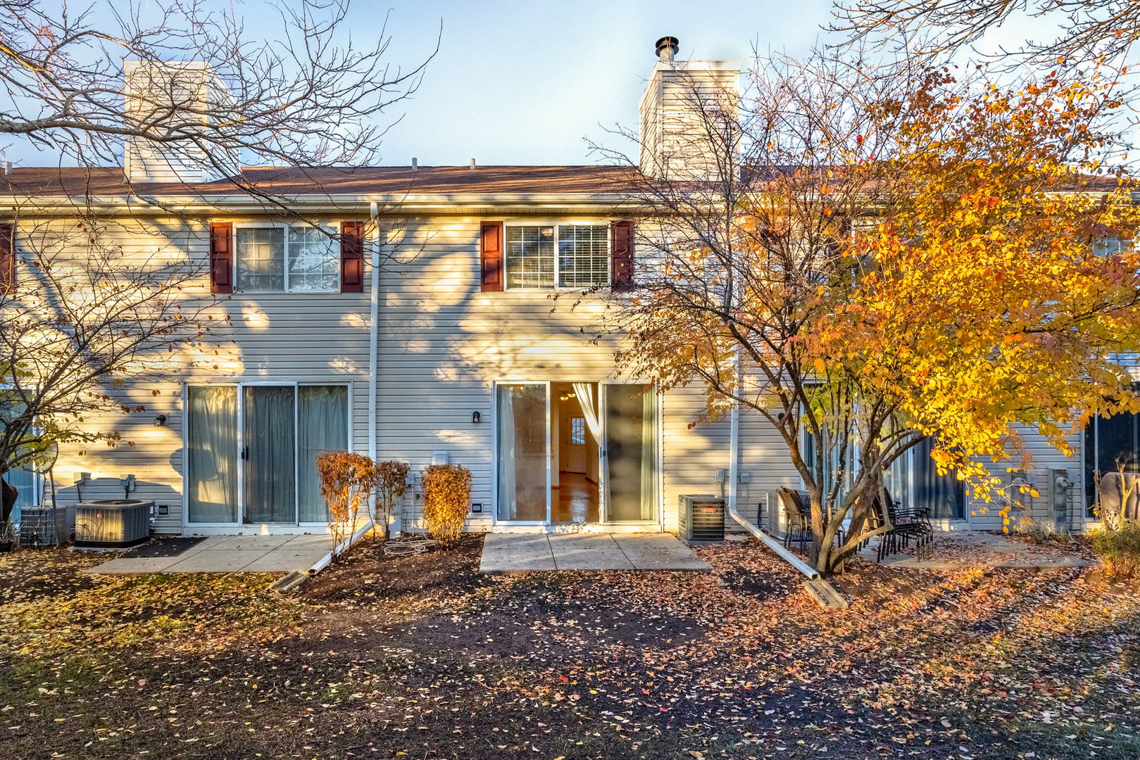 100 Harvest Gate, Unit 100 Lake In The Hills, IL 60156 - Photo 16 of 17 a view of a building with a yard