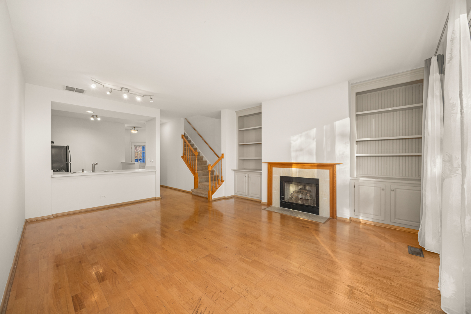 100 Harvest Gate, Unit 100 Lake In The Hills, IL 60156 - Photo 3 of 17 a view of a livingroom with a fireplace