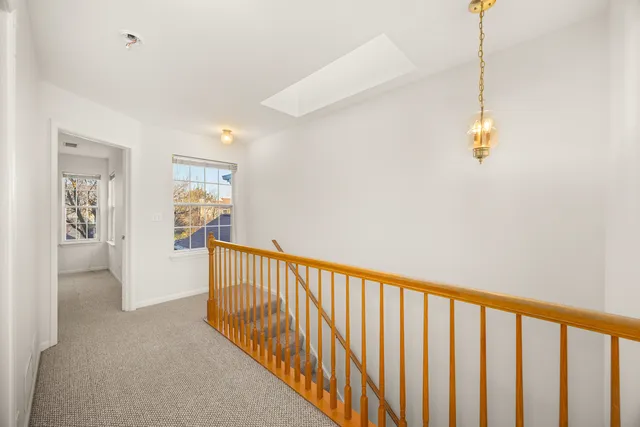 a view of a hallway with windows