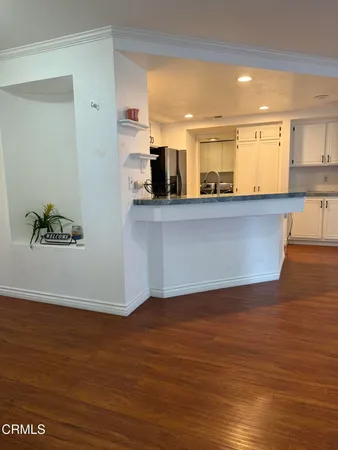 a view of kitchen with wooden floor