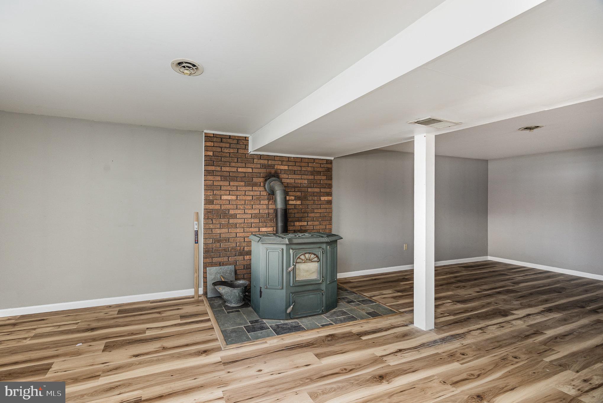 1016 Teakwood Lane Enola, PA 17025 - Photo 21 of 37 Family room with rice coal stove (not wood)