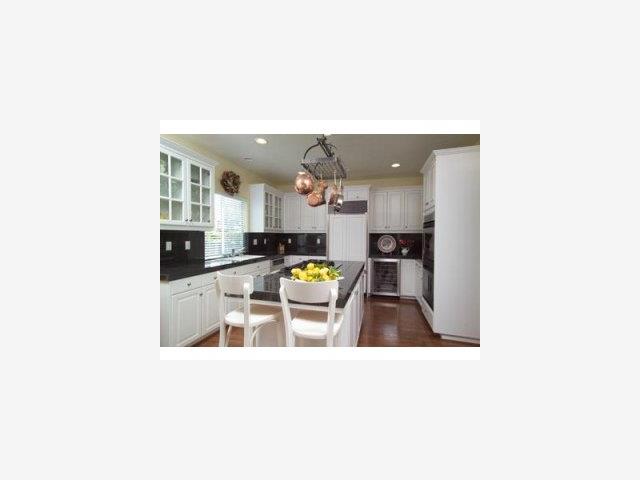 58 Merion Road Half Moon Bay, CA 94019 - Photo 6 of 9 a kitchen with stainless steel appliances kitchen island granite countertop a sink and cabinets