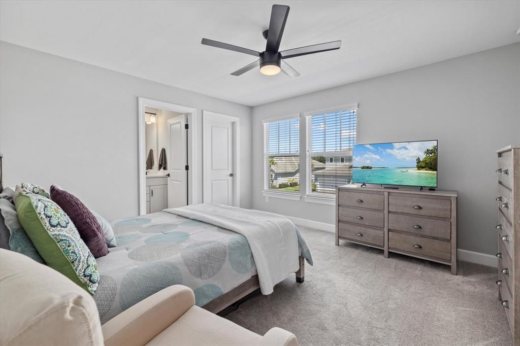 3508 Anchor Bay Trail Lakewood Ranch, FL 34211 - Photo 28 of 74 a bedroom with a bed dresser and a window