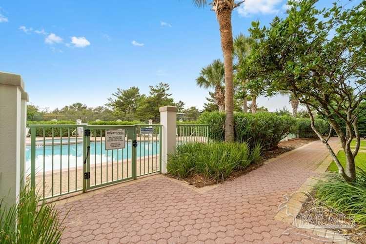 9955 East County Highway 30A, Unit 202 Inlet Beach, FL 32461 - Photo 7 of 8 a view of a backyard with potted plants and large trees