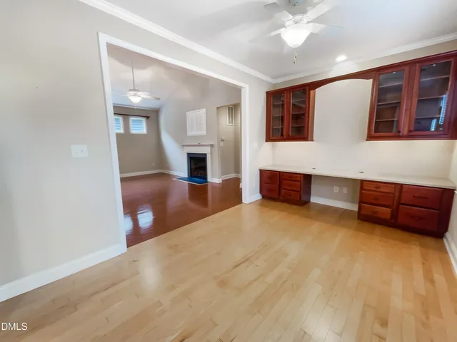 a spacious bedroom with a bed and a view of balcony