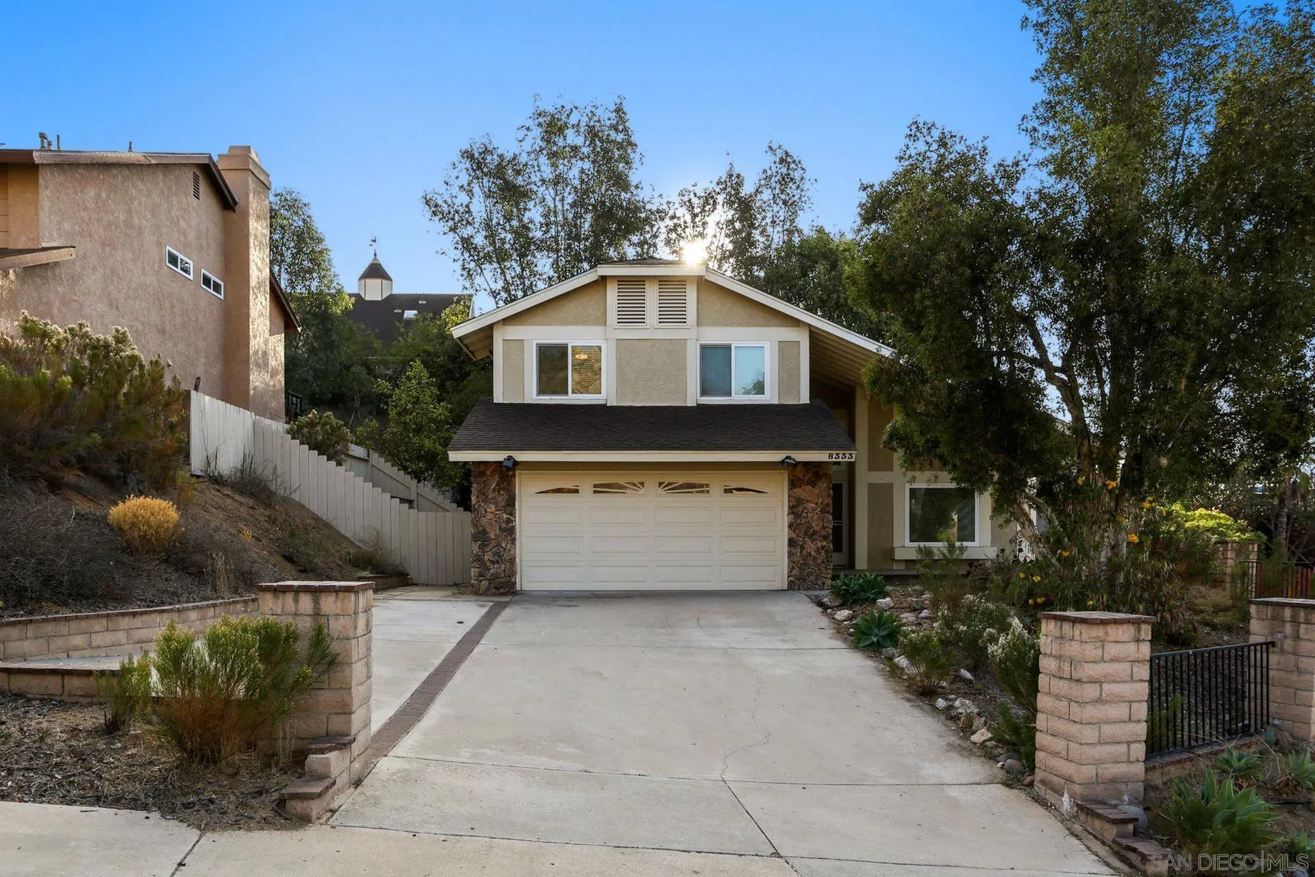 8333 Oconnell Road El Cajon, CA 92021 - Photo 2 of 32 a front view of a house with a yard and garage