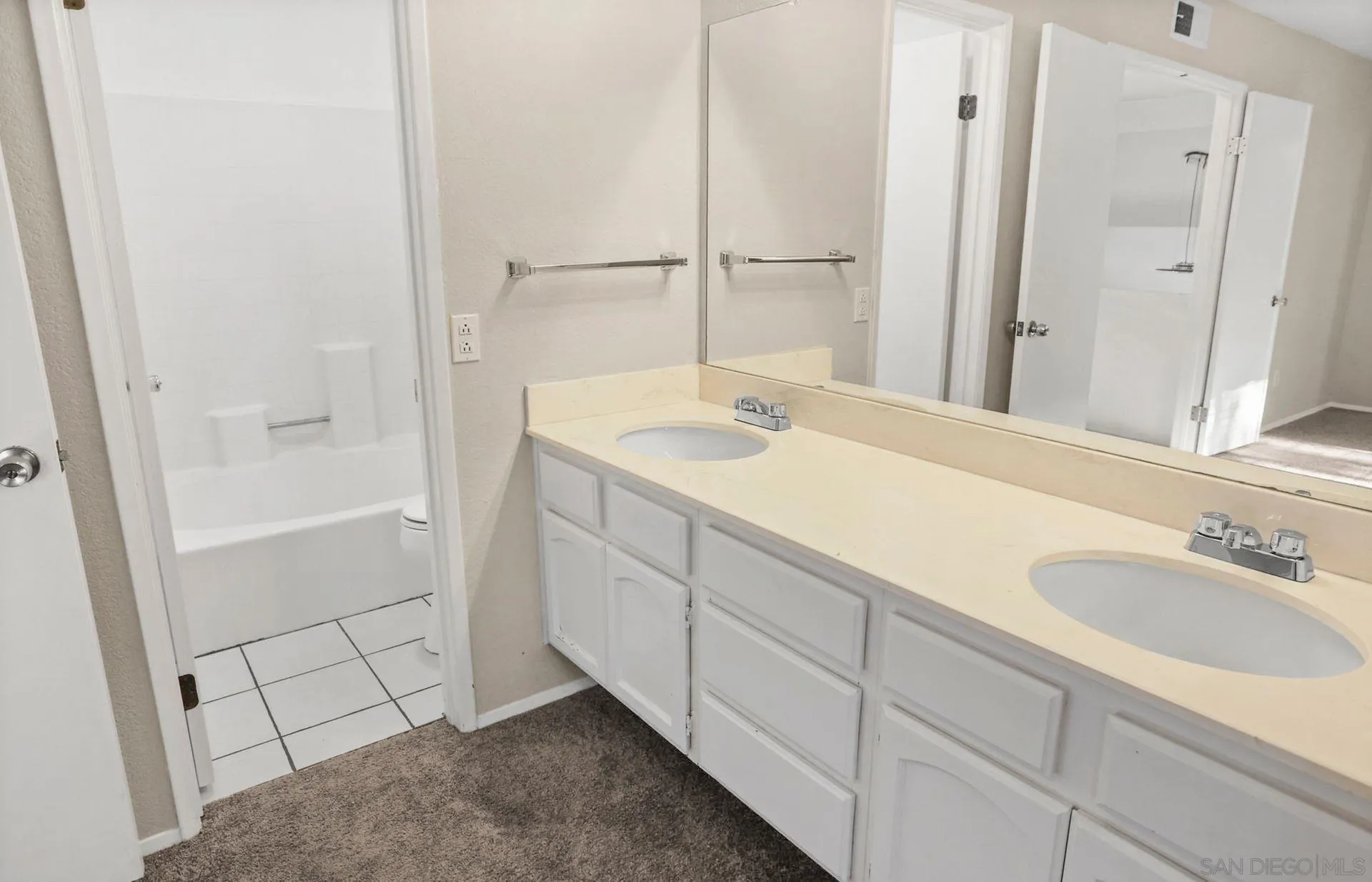 8333 Oconnell Road El Cajon, CA 92021 - Photo 22 of 32 a bathroom with a sink and a mirror with bathtub