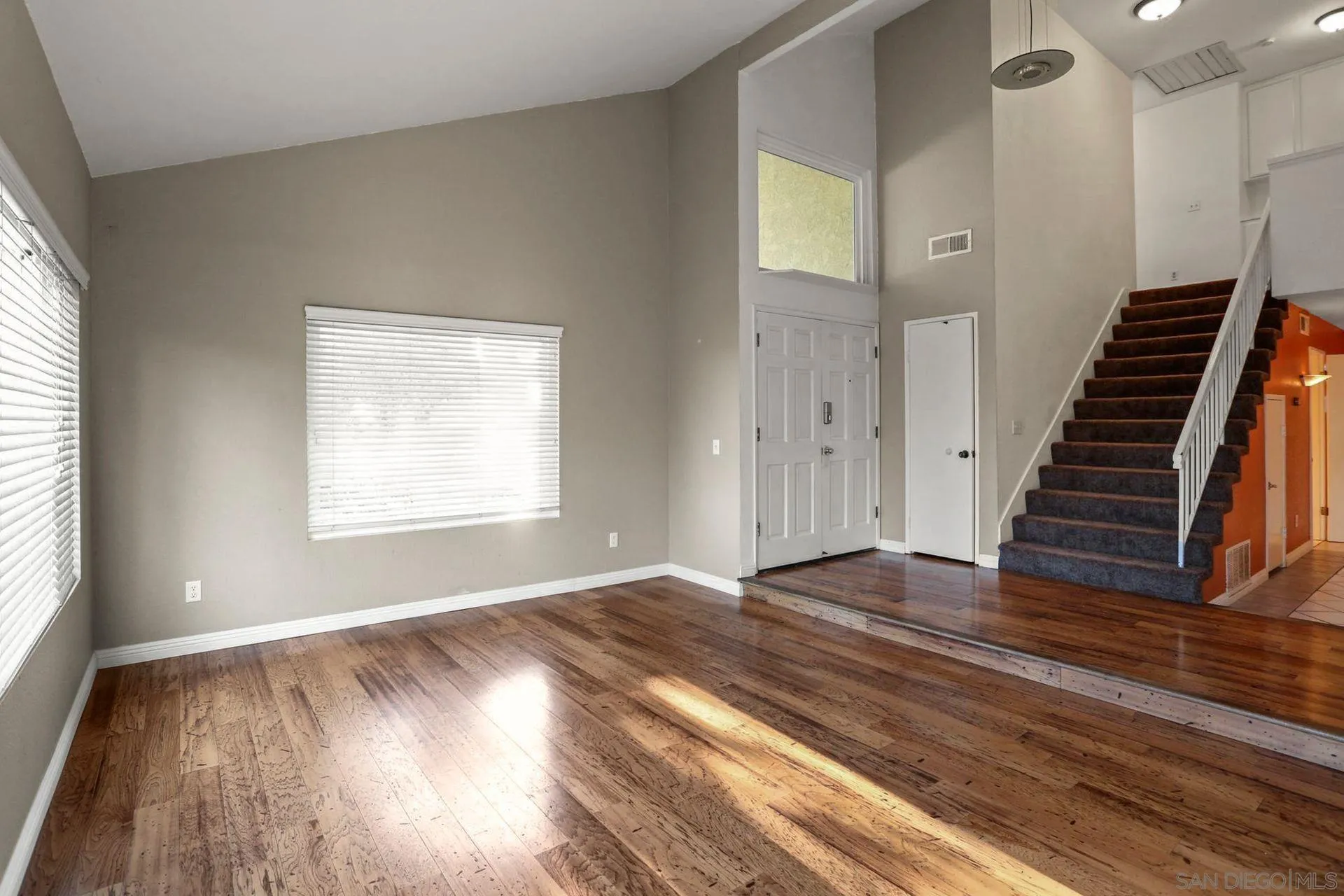 8333 Oconnell Road El Cajon, CA 92021 - Photo 6 of 32 an empty room with wooden floor and windows