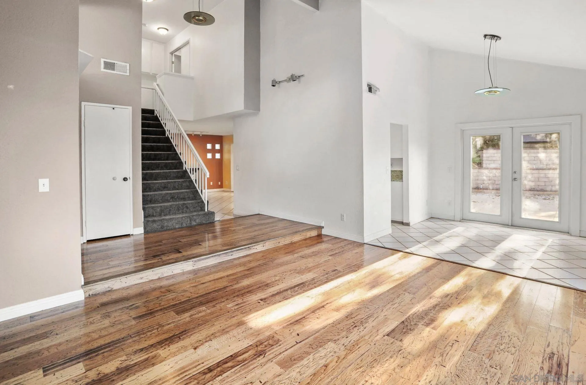 8333 Oconnell Road El Cajon, CA 92021 - Photo 8 of 32 a view of a hallway with wooden floor and staircase